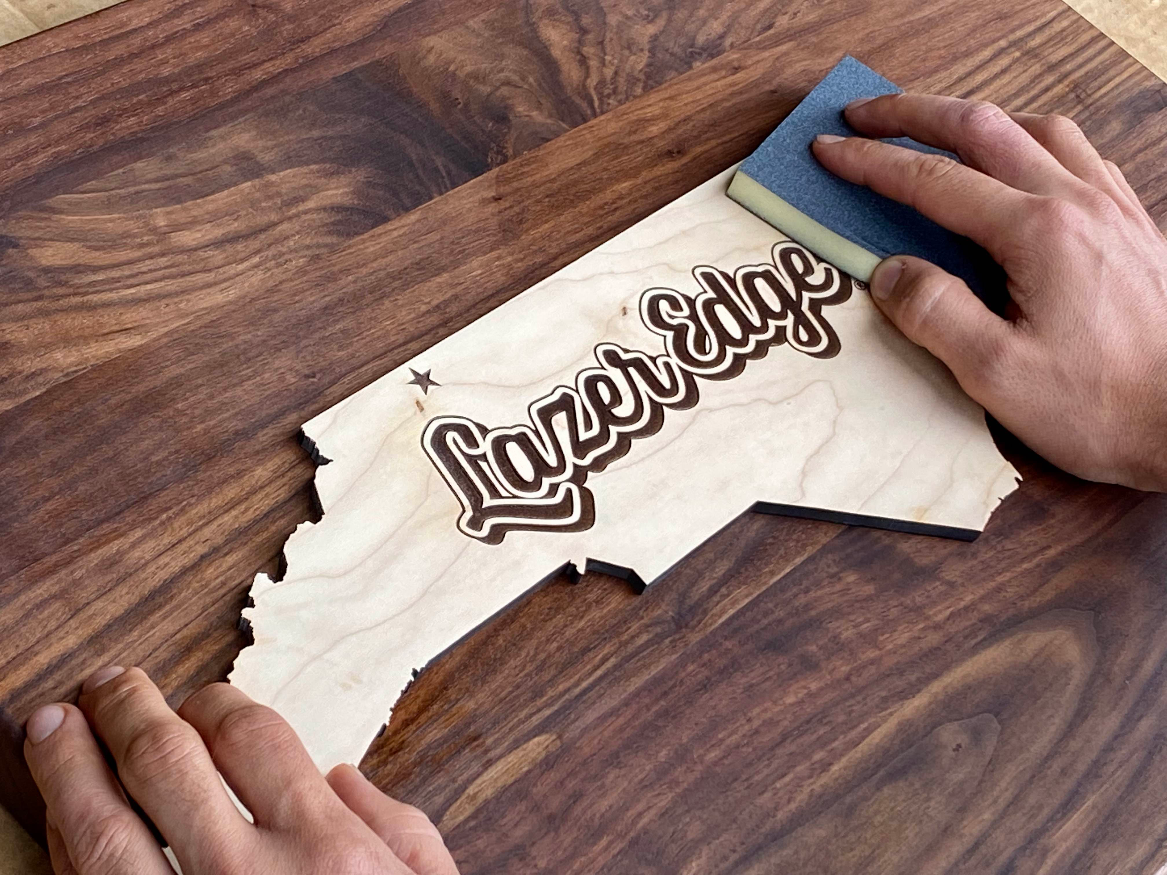 Hands finishing a custom Lazeredge Piece